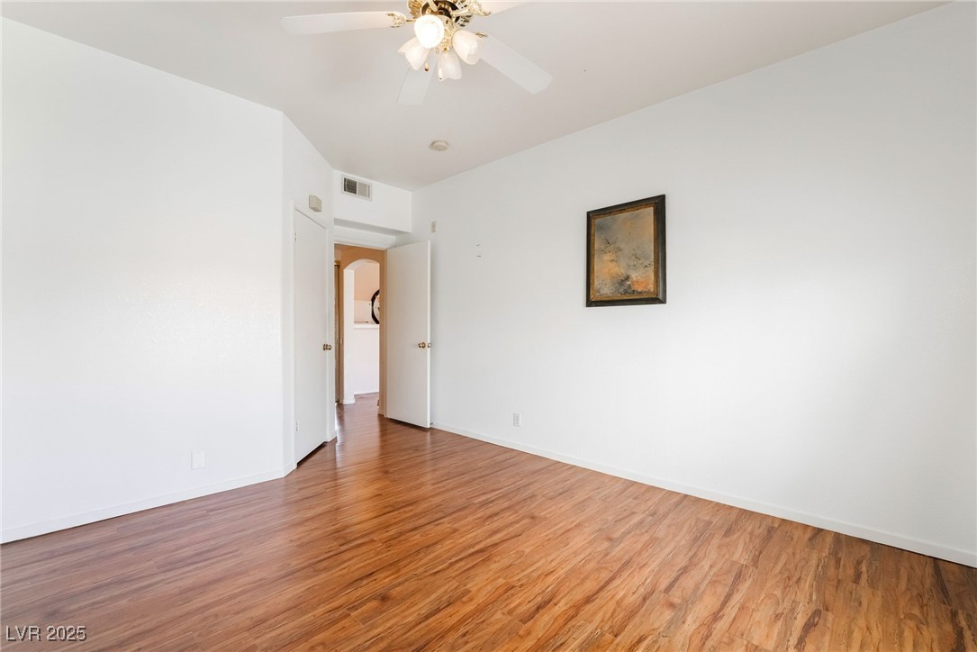 2201 Ramsgate Drive, Unit 823 Henderson, NV 89074 - Photo 18 of 31 Unfurnished room with visible vents, baseboards, and light wood-style flooring
