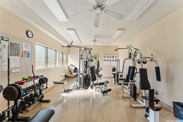 a view of a livingroom with furniture and staircase
