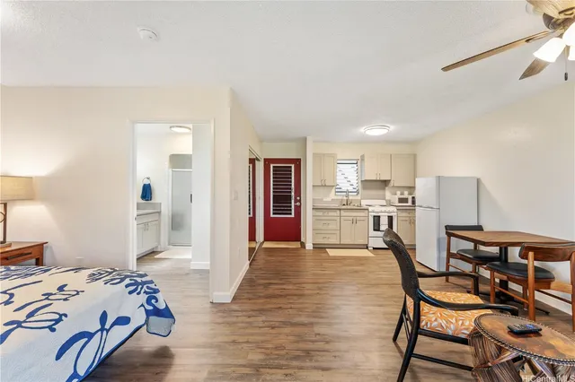 a bedroom with a bed and a table in it