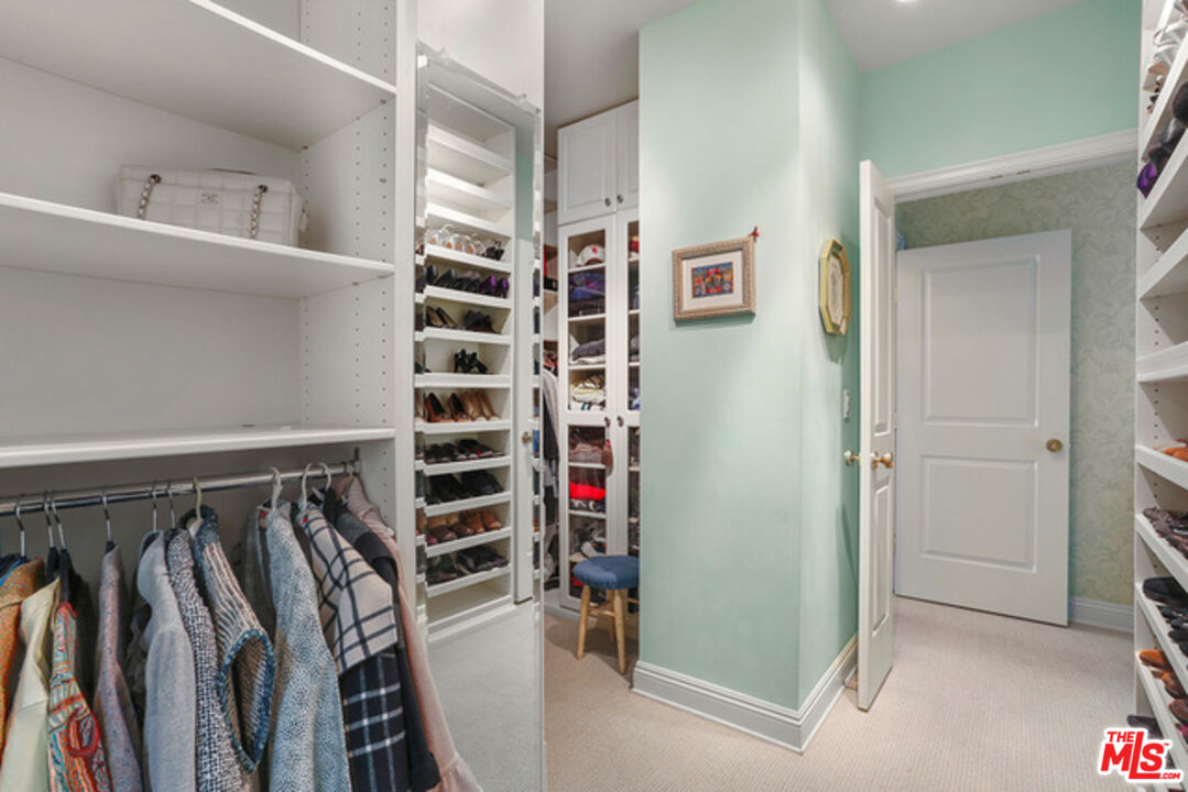 10580 Wilshire Boulevard, Unit 19NW Los Angeles, CA 90024 - Photo 15 of 20 a view of walk in closet with clothes and shoes