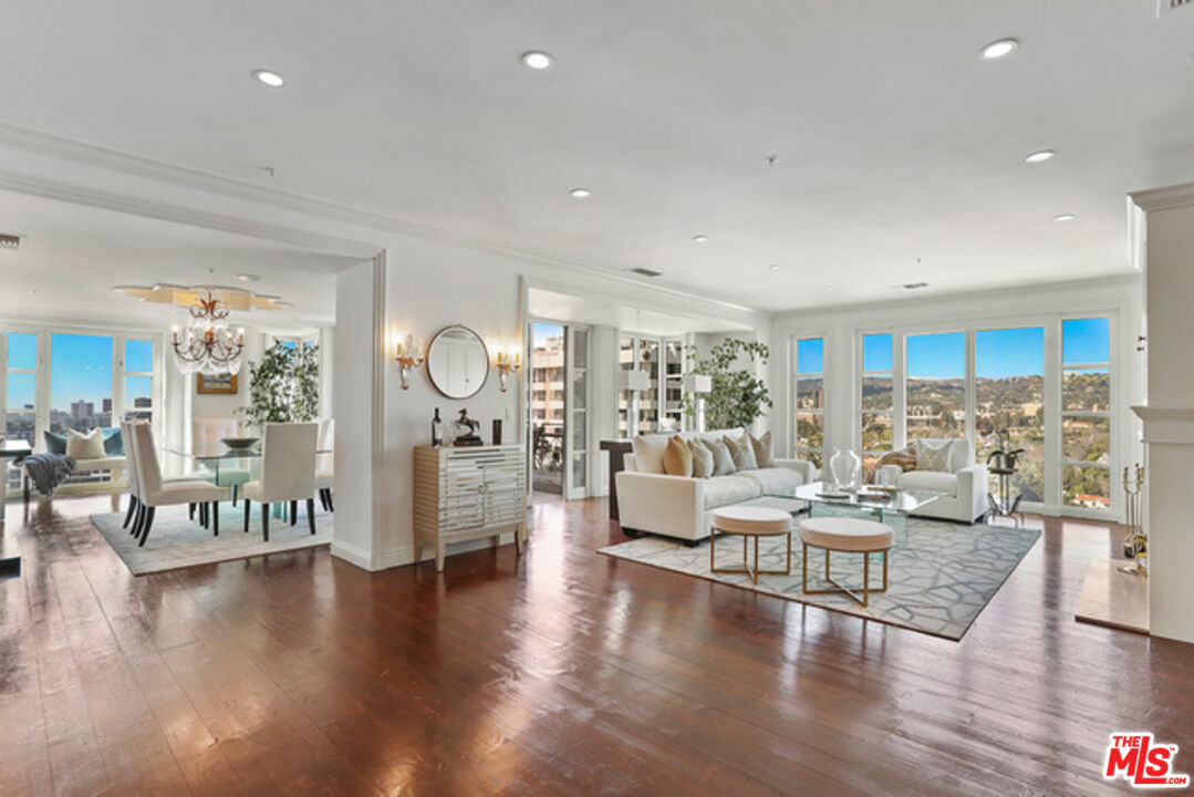 10580 Wilshire Boulevard, Unit 19NW Los Angeles, CA 90024 - Photo 4 of 20 a living room with fireplace furniture and wooden floor