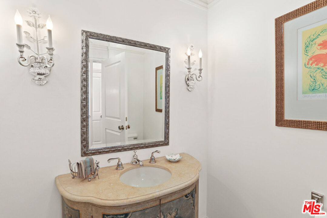 10580 Wilshire Boulevard, Unit 19NW Los Angeles, CA 90024 - Photo 9 of 20 a bathroom with a sink and a mirror