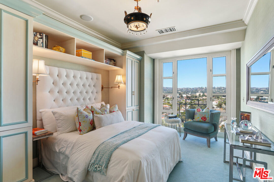 10580 Wilshire Boulevard, Unit 19NW Los Angeles, CA 90024 - Photo 10 of 20 a bedroom with a large bed and a window