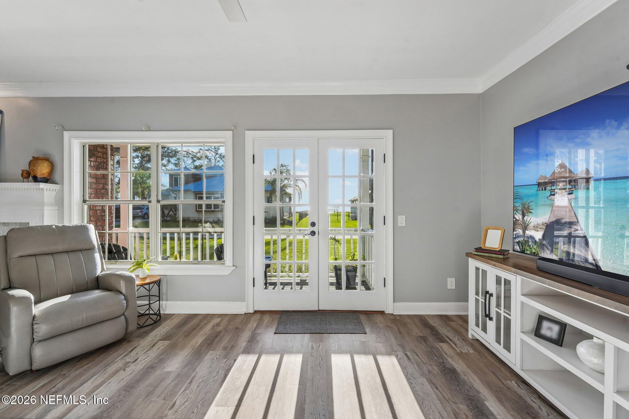 1544 Community Point Fleming Island, FL 32003 - Photo 24 of 95 Living Room - Screened Lanai Access