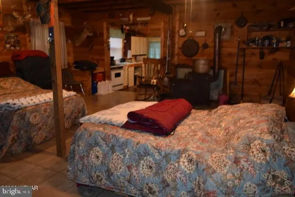 a large bed sitting in a bedroom next to a bedroom