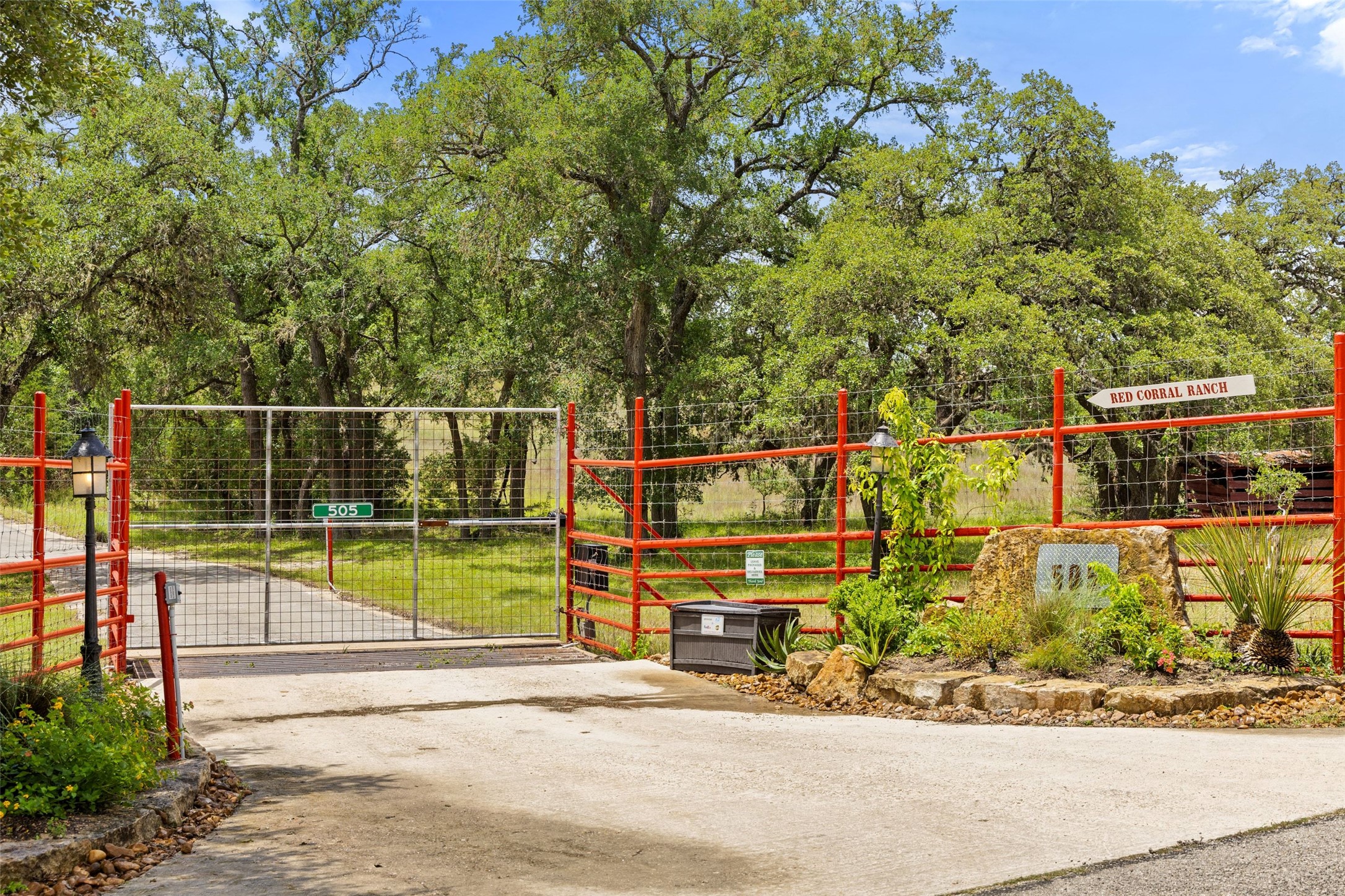 505 Red Corral Ranch Road Wimberley, TX 78676 - Photo 16 of 40 A private gated entry welcomes you to a serene ranch property.