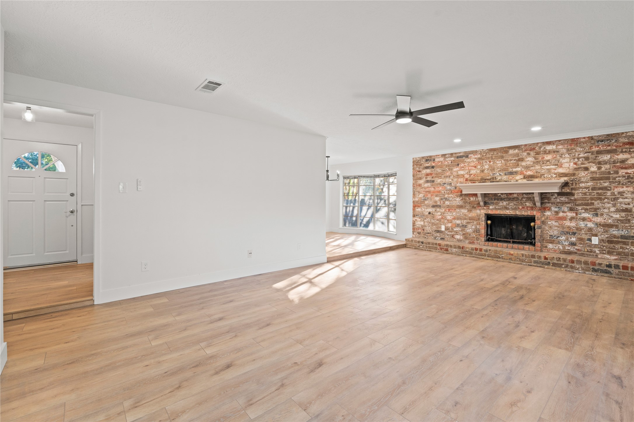 19415 Enchanted Oaks Drive Spring, TX 77388 - Photo 12 of 48 an empty room with windows and fireplace