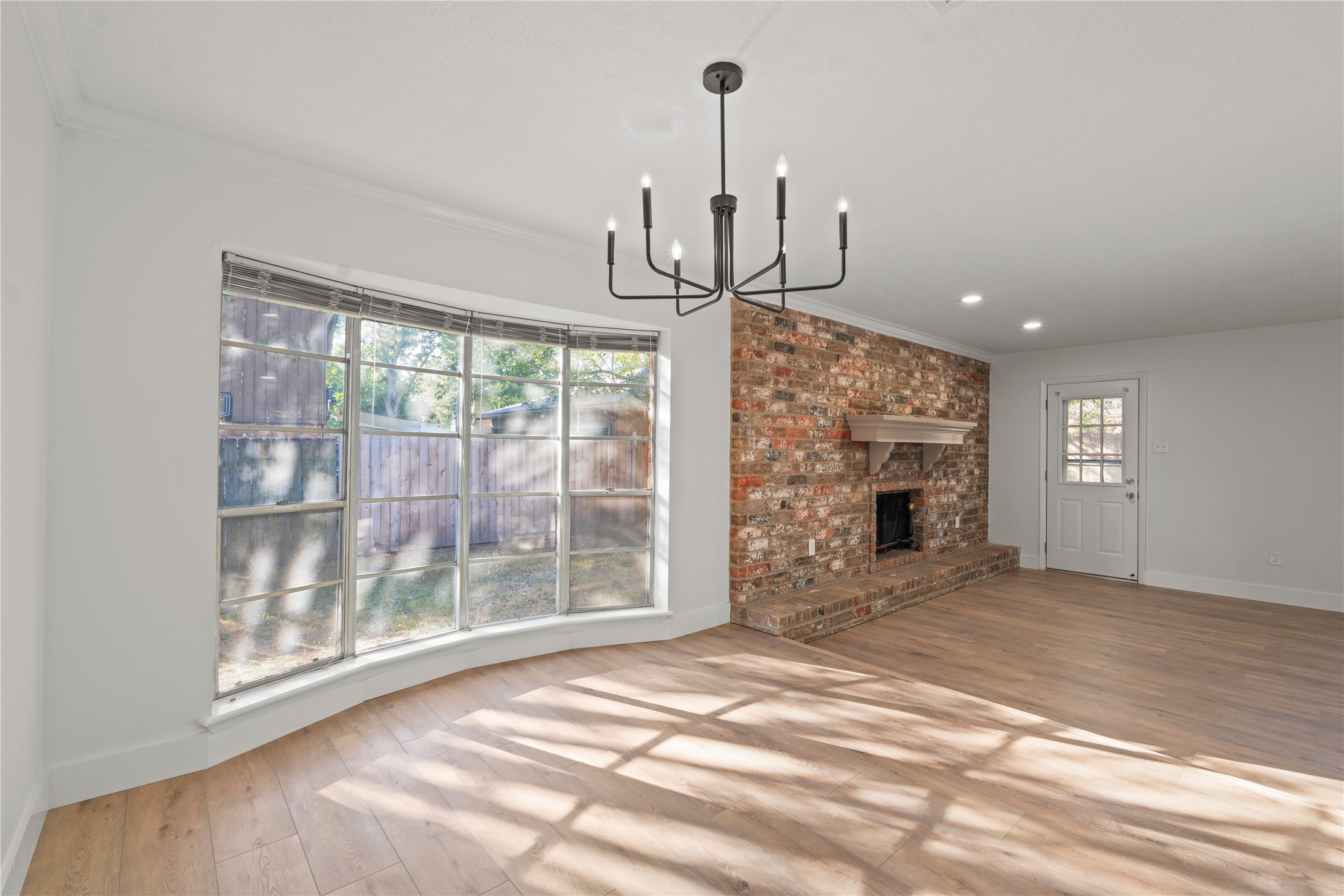 19415 Enchanted Oaks Drive Spring, TX 77388 - Photo 13 of 48 a view of empty room with fireplace and window