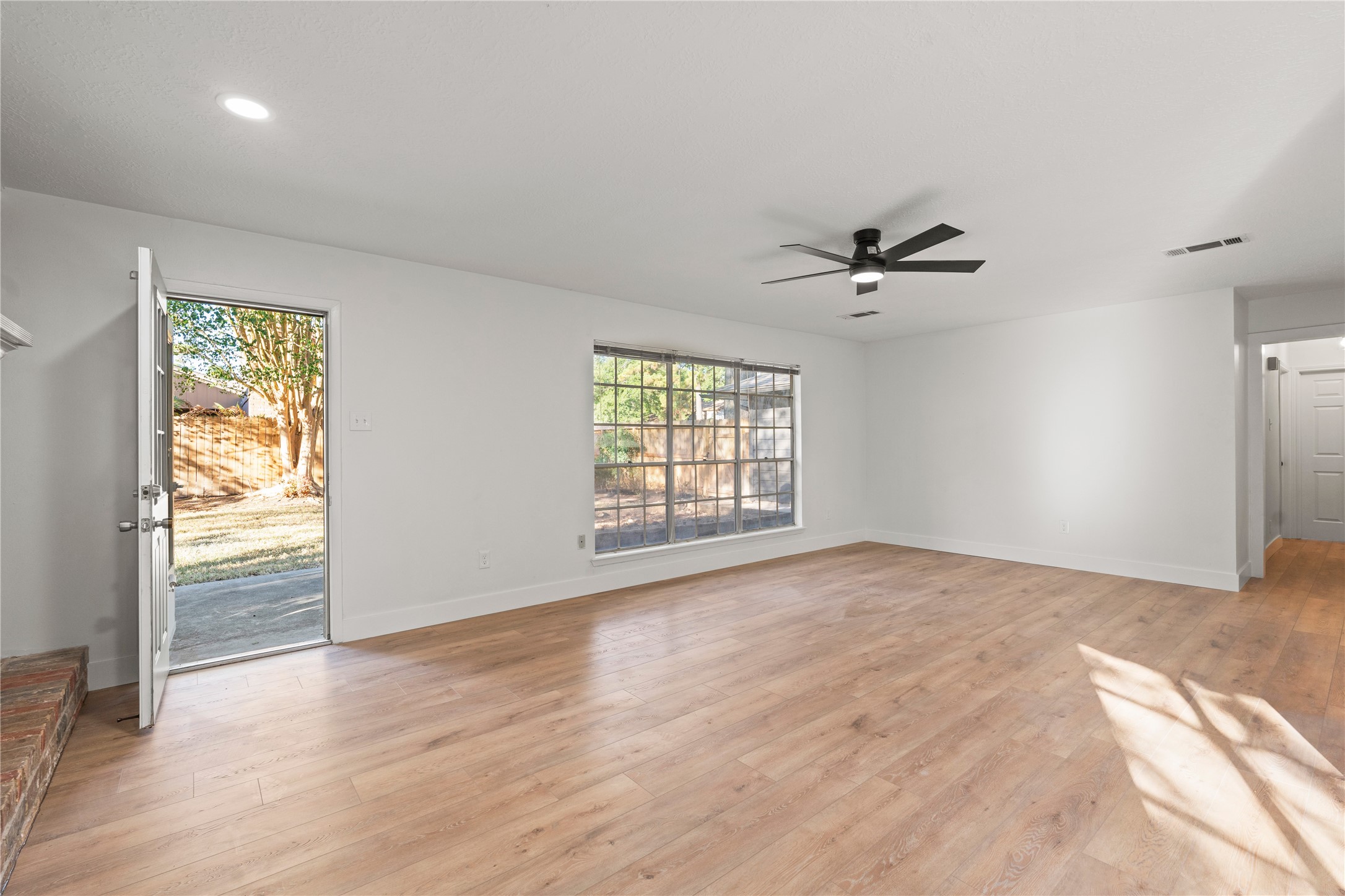 19415 Enchanted Oaks Drive Spring, TX 77388 - Photo 20 of 48 a view of a livingroom with a window and wooden floor