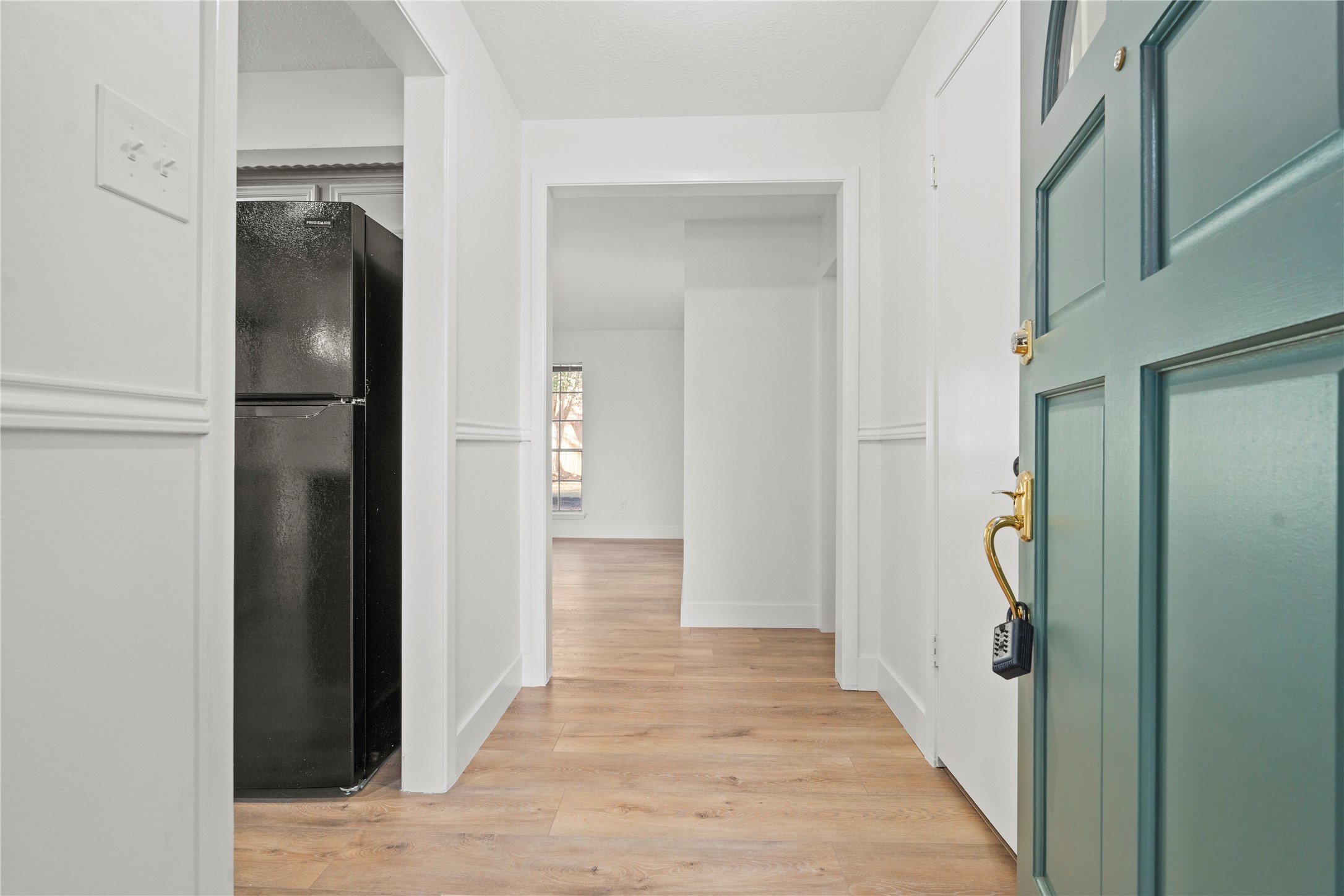 19415 Enchanted Oaks Drive Spring, TX 77388 - Photo 2 of 48 a view of hallway with walk in closet and wooden floor