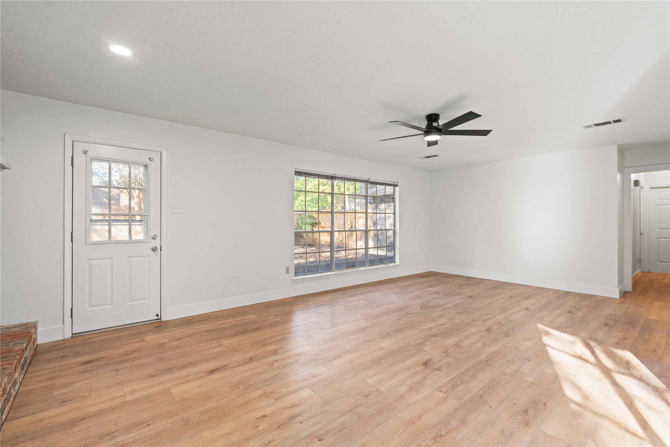 19415 Enchanted Oaks Drive Spring, TX 77388 - Photo 21 of 48 a view of a livingroom with a ceiling fan and window