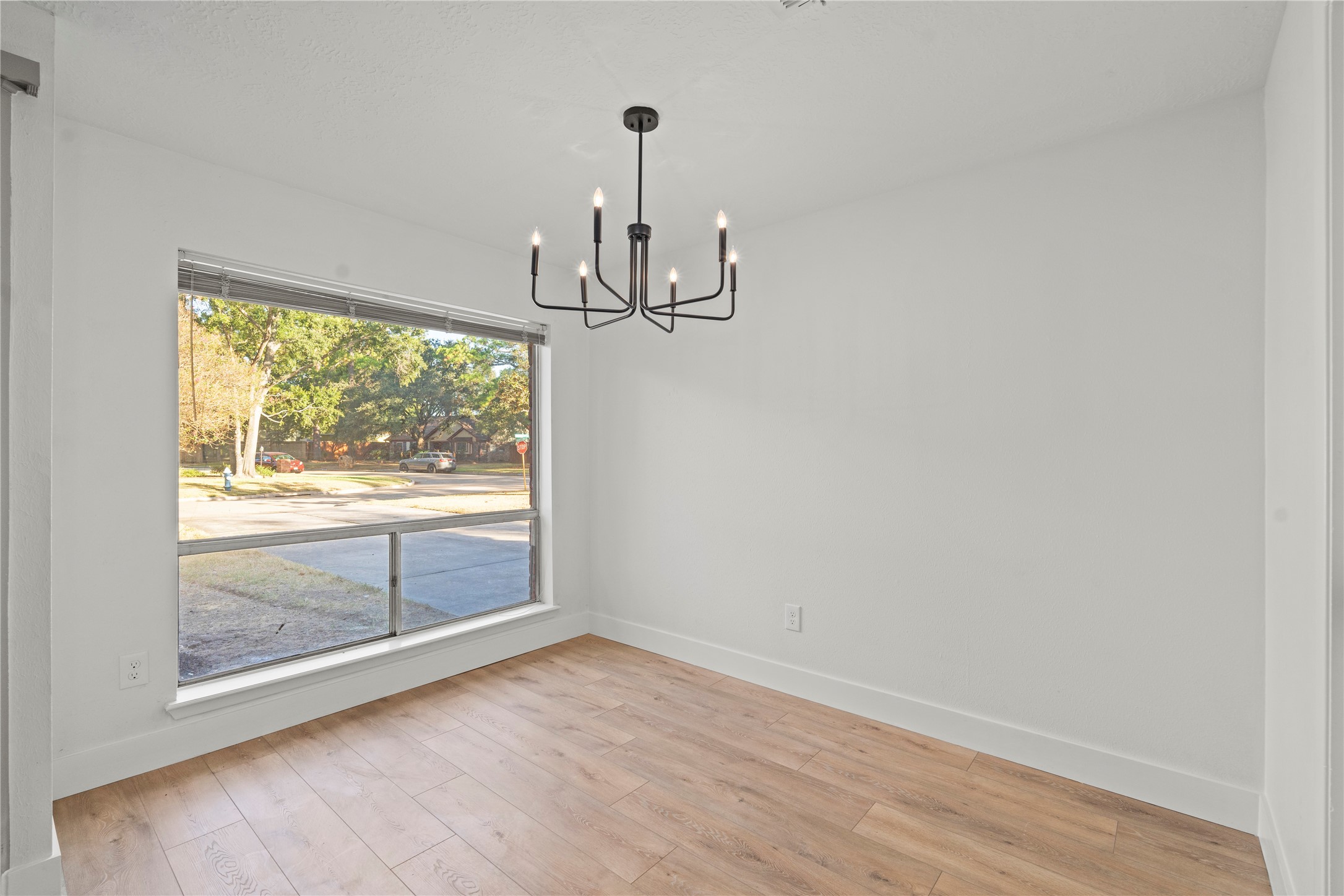 19415 Enchanted Oaks Drive Spring, TX 77388 - Photo 22 of 48 a view of empty room with wooden floor and fan