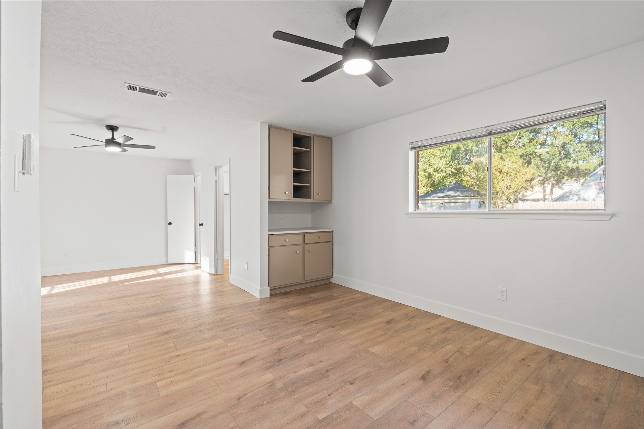 19415 Enchanted Oaks Drive Spring, TX 77388 - Photo 28 of 48 a view of an empty room with a window and wooden floor