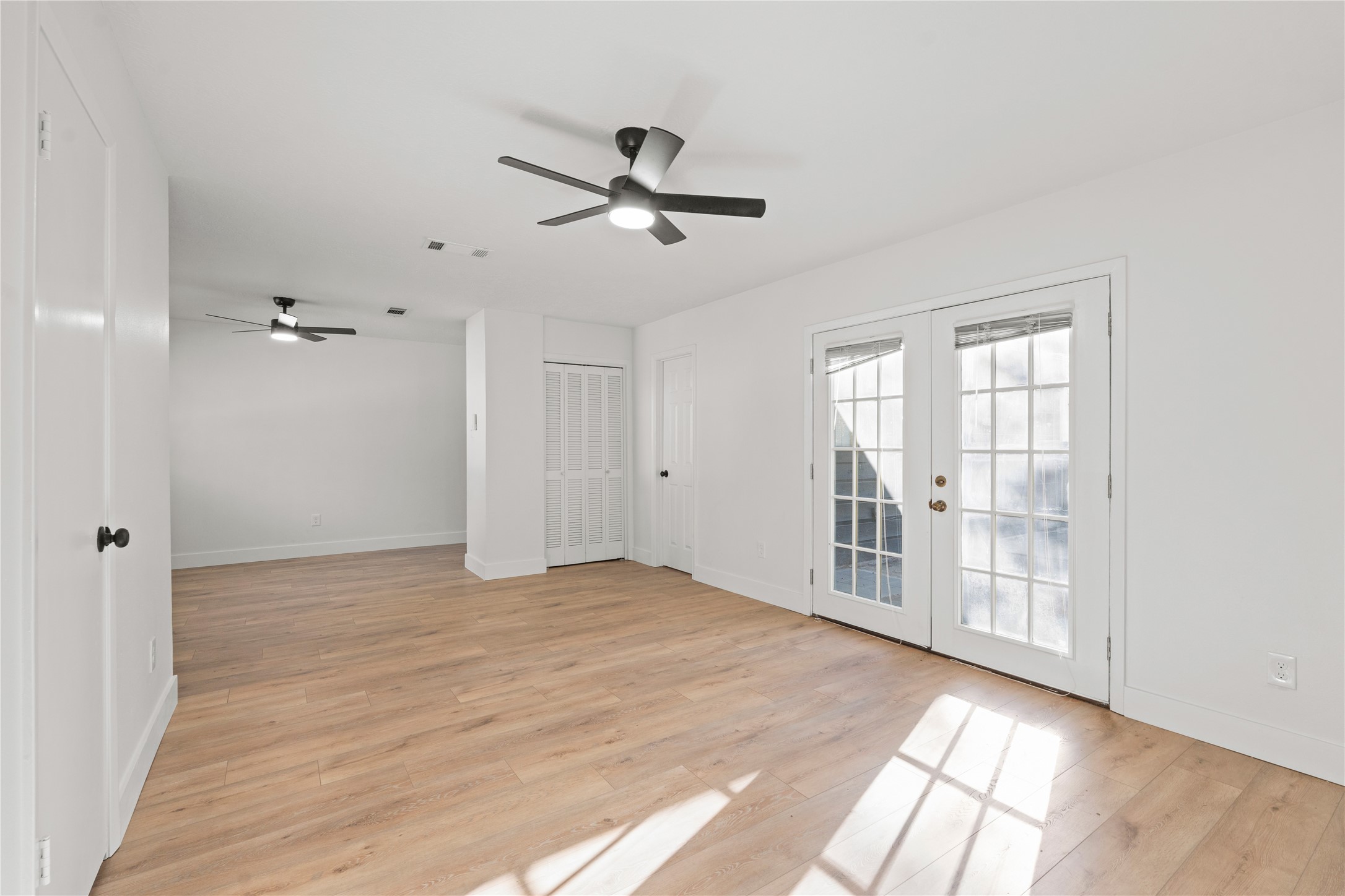 19415 Enchanted Oaks Drive Spring, TX 77388 - Photo 35 of 48 a view of empty room with wooden floor and fan