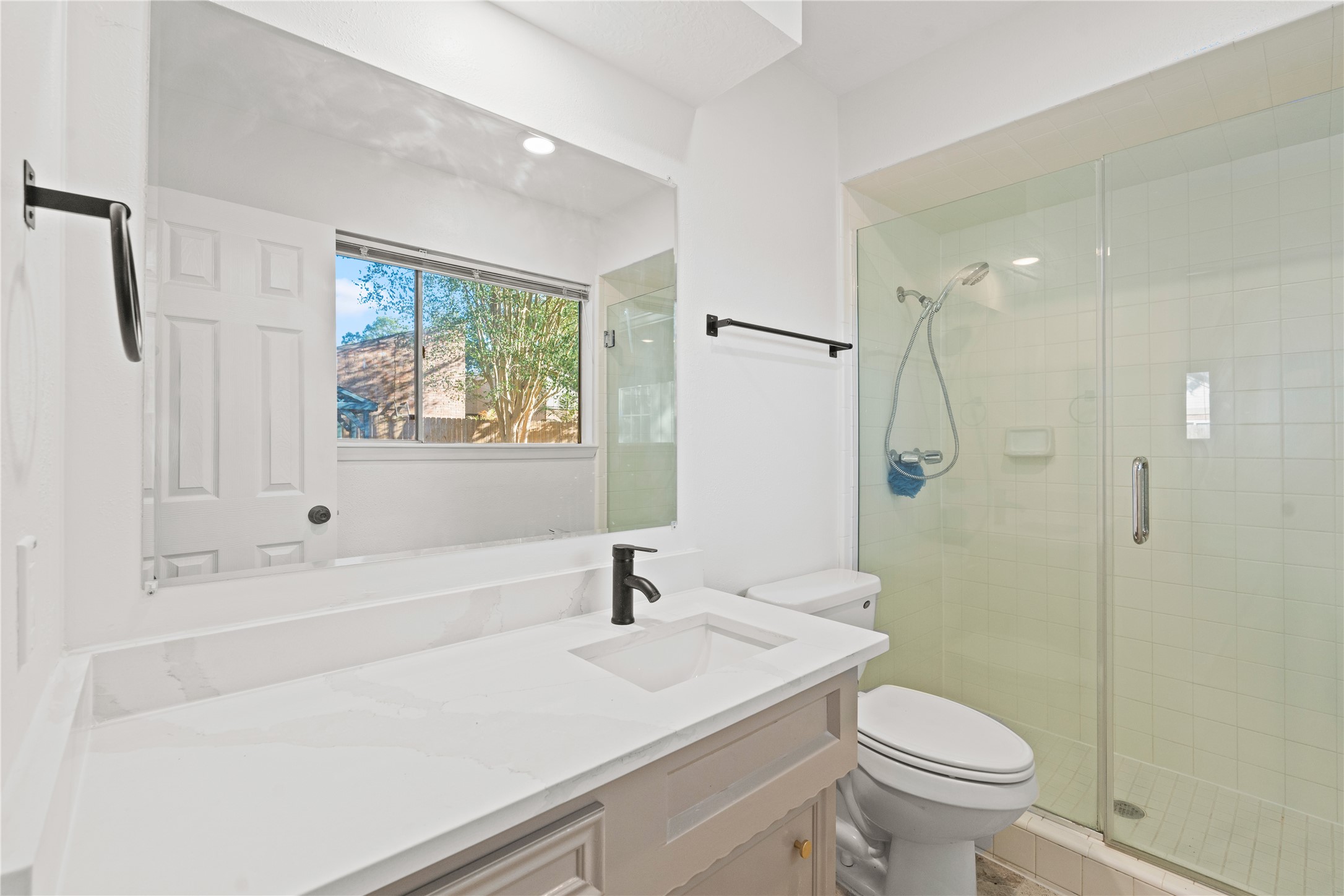 19415 Enchanted Oaks Drive Spring, TX 77388 - Photo 39 of 48 a bathroom with a sink a toilet and shower