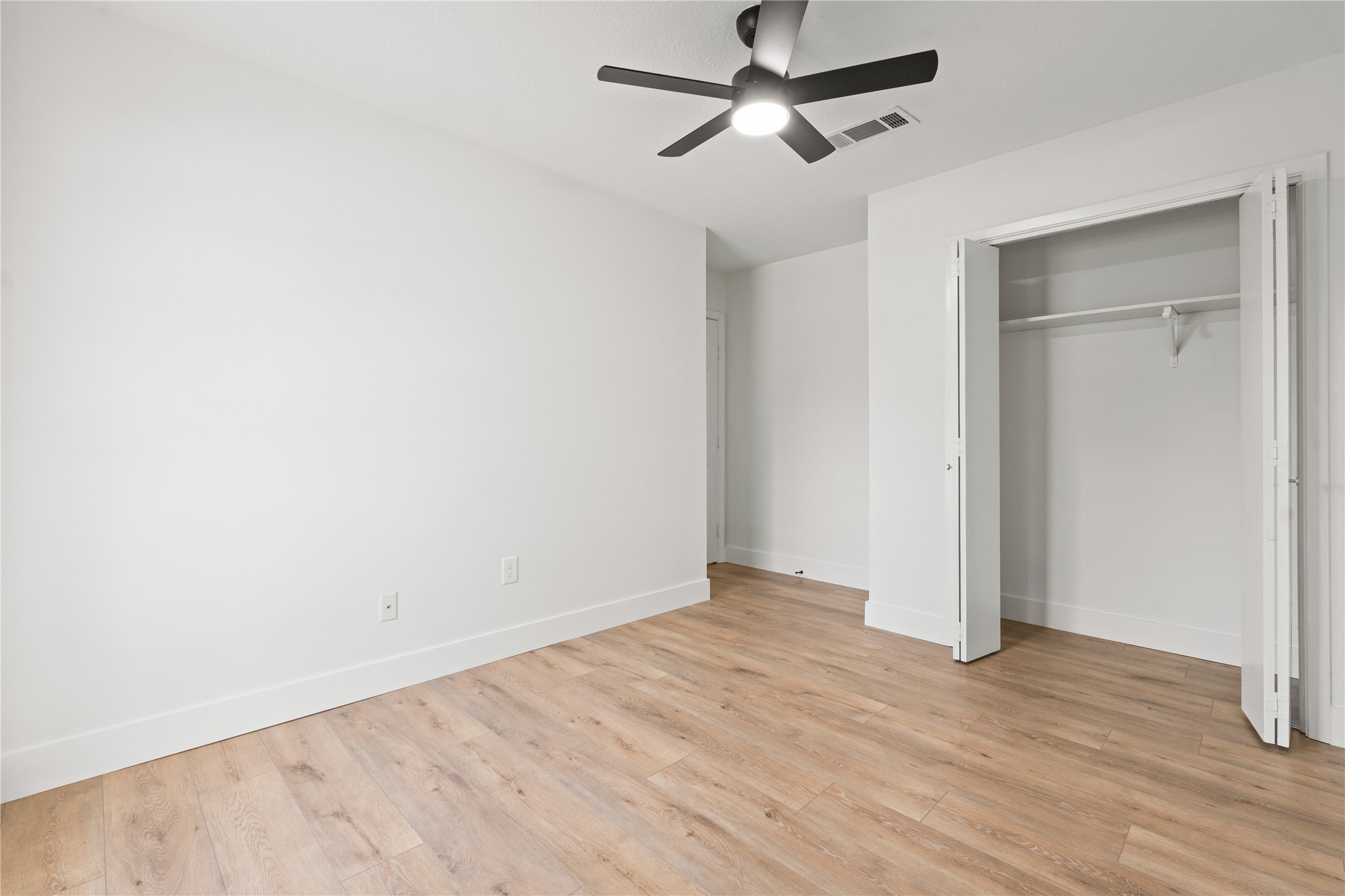 19415 Enchanted Oaks Drive Spring, TX 77388 - Photo 41 of 48 a view of empty room with wooden floor