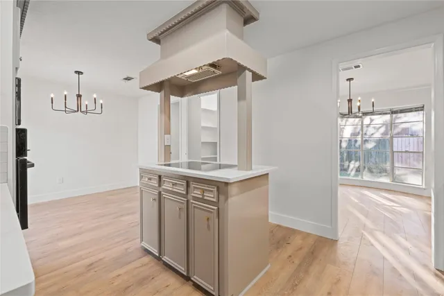 a view of cabinets and wooden floor