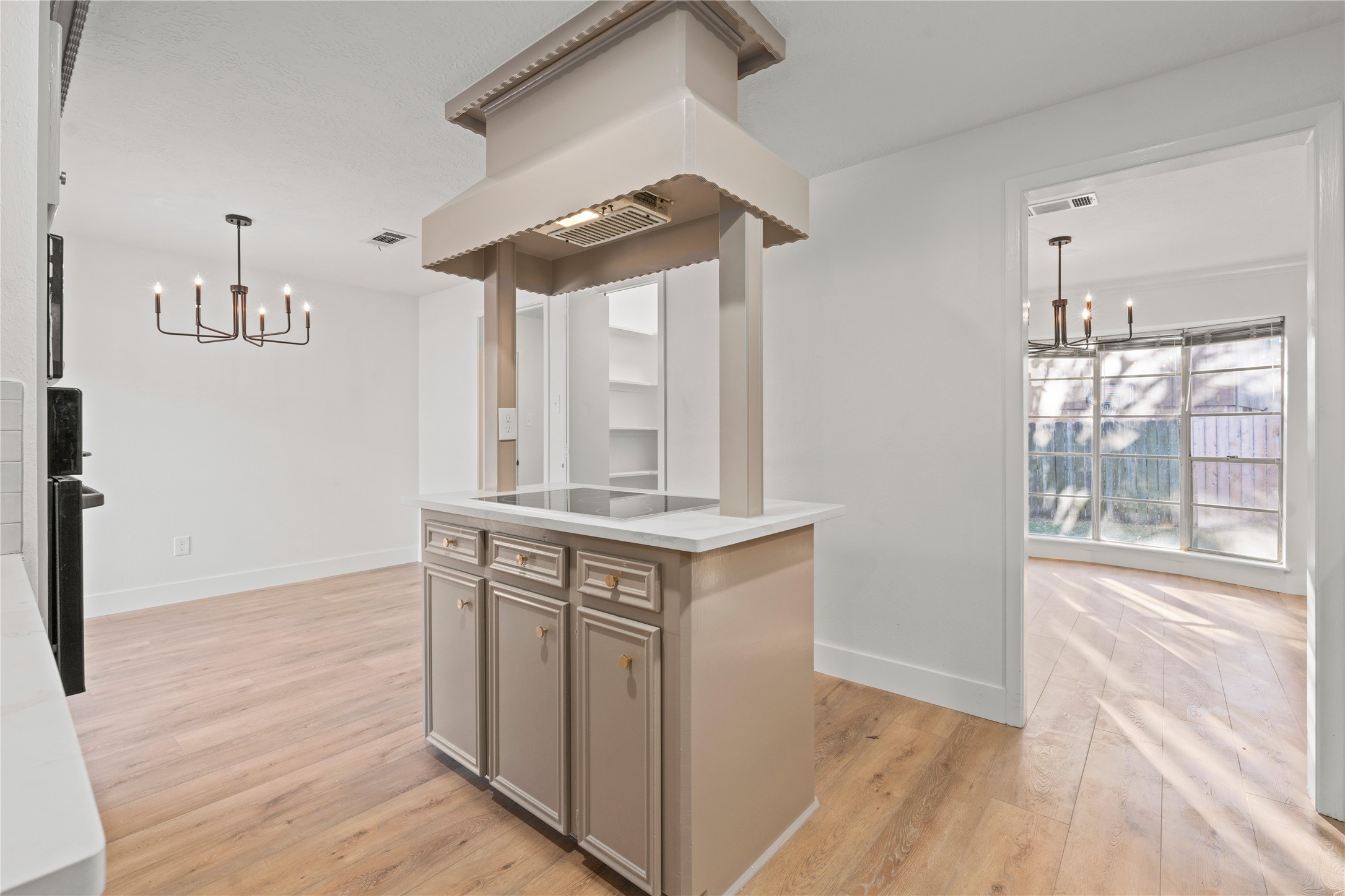 19415 Enchanted Oaks Drive Spring, TX 77388 - Photo 6 of 48 a view of cabinets and wooden floor