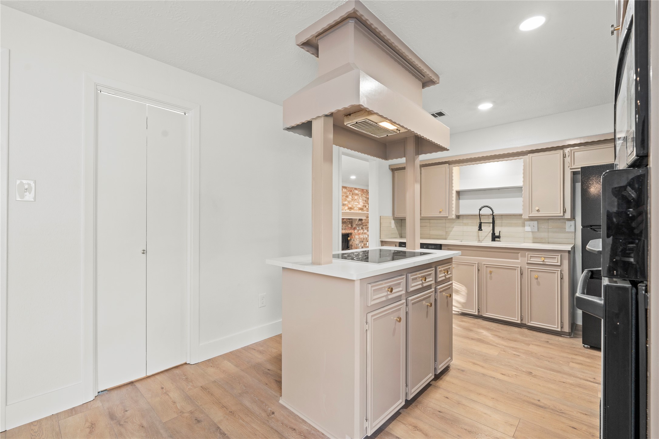 19415 Enchanted Oaks Drive Spring, TX 77388 - Photo 8 of 48 a kitchen with a sink stove and refrigerator