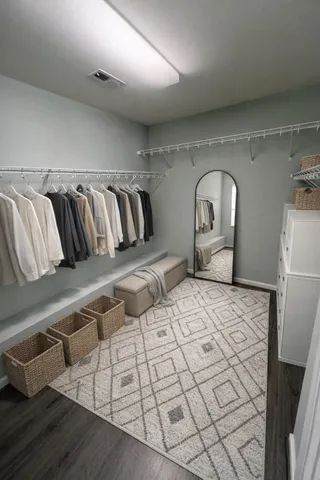 a bedroom with a large bed and a couch