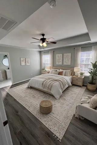 a bedroom with furniture and a window