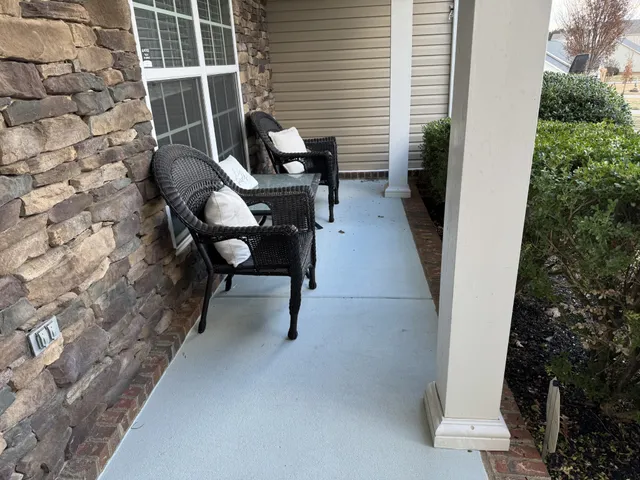 a view of a balcony with chairs