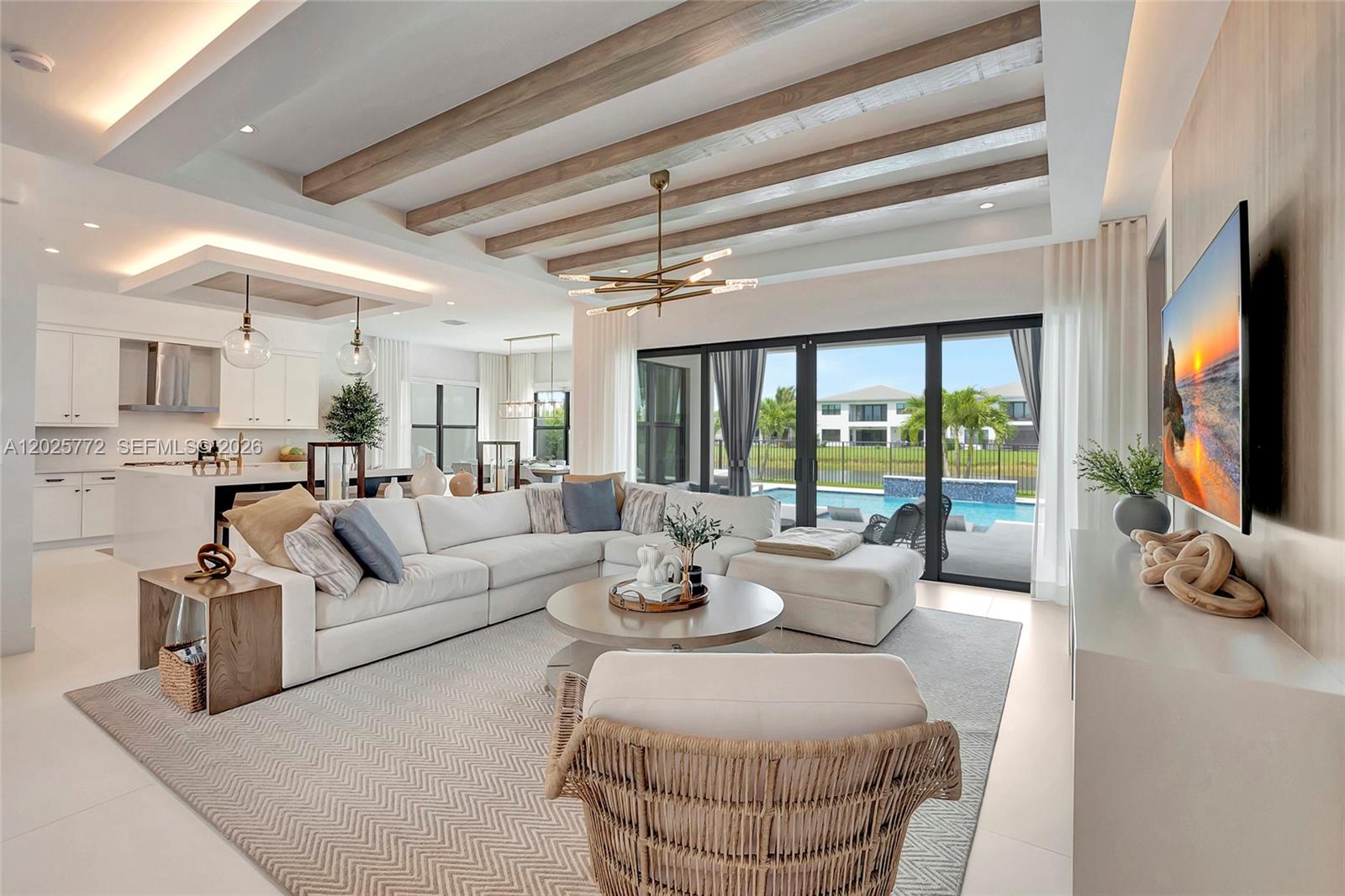 17023 Wandering Wave Avenue Boca Raton, FL 33496 - Photo 12 of 84 a living room with furniture a flat screen tv and a floor to ceiling window