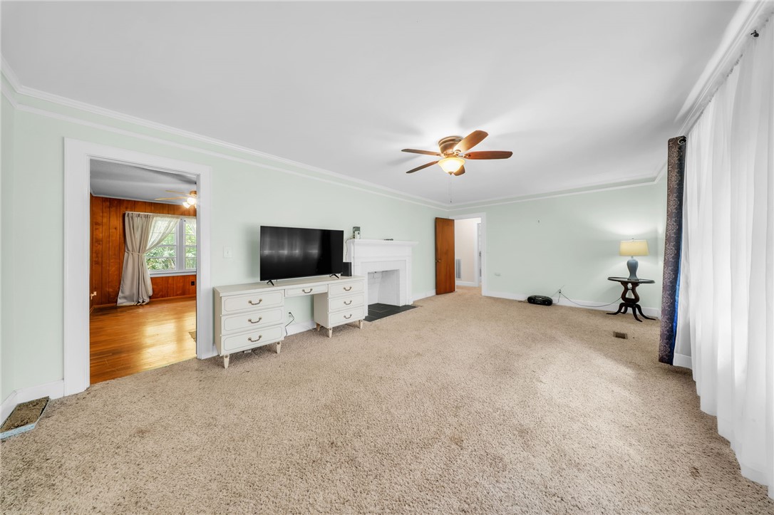 An inviting fireplace serves as the centerpiece of this comfortable living space.
