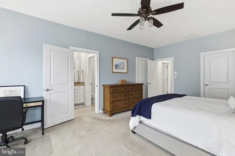 a spacious bedroom with a bed and furniture