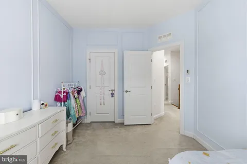 a bathroom with a sink mirror and vanity