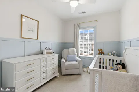 a bedroom with furniture and window