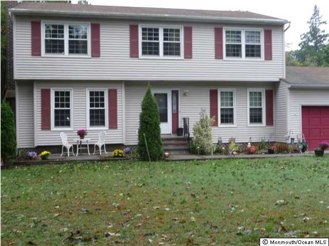 708 Cassville Road Jackson, NJ 08527 - Photo 1 of 3 a front view of a house with a yard