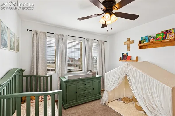 a bedroom with furniture and a window