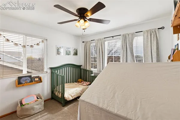 a bedroom with furniture and windows