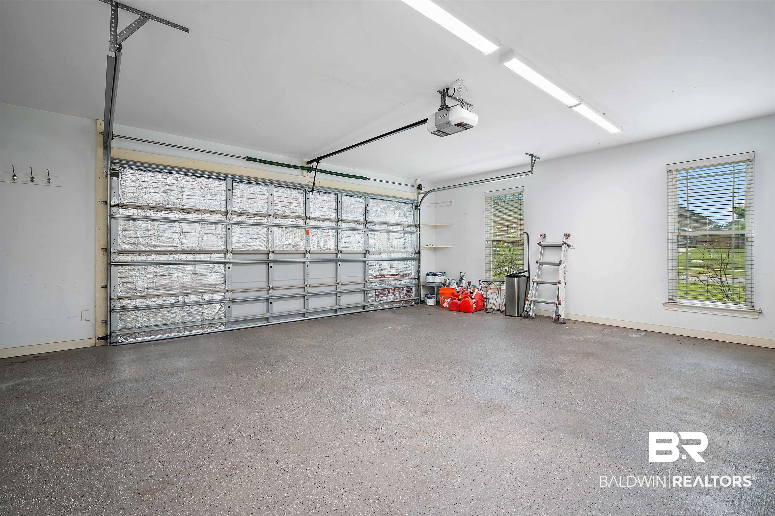 1685 Stonebridge Court Mobile, AL 36695 - Photo 26 of 29 Garage featuring baseboards and a garage door opener