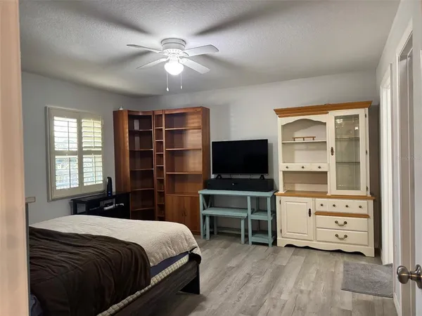 a bedroom with a bed and furniture