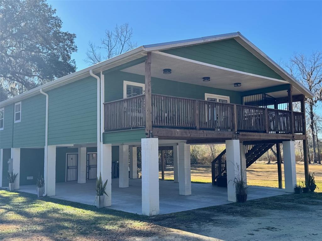 38706 River Road Dade City, FL 33525 - Photo 2 of 30 a view of front door and potted plants
