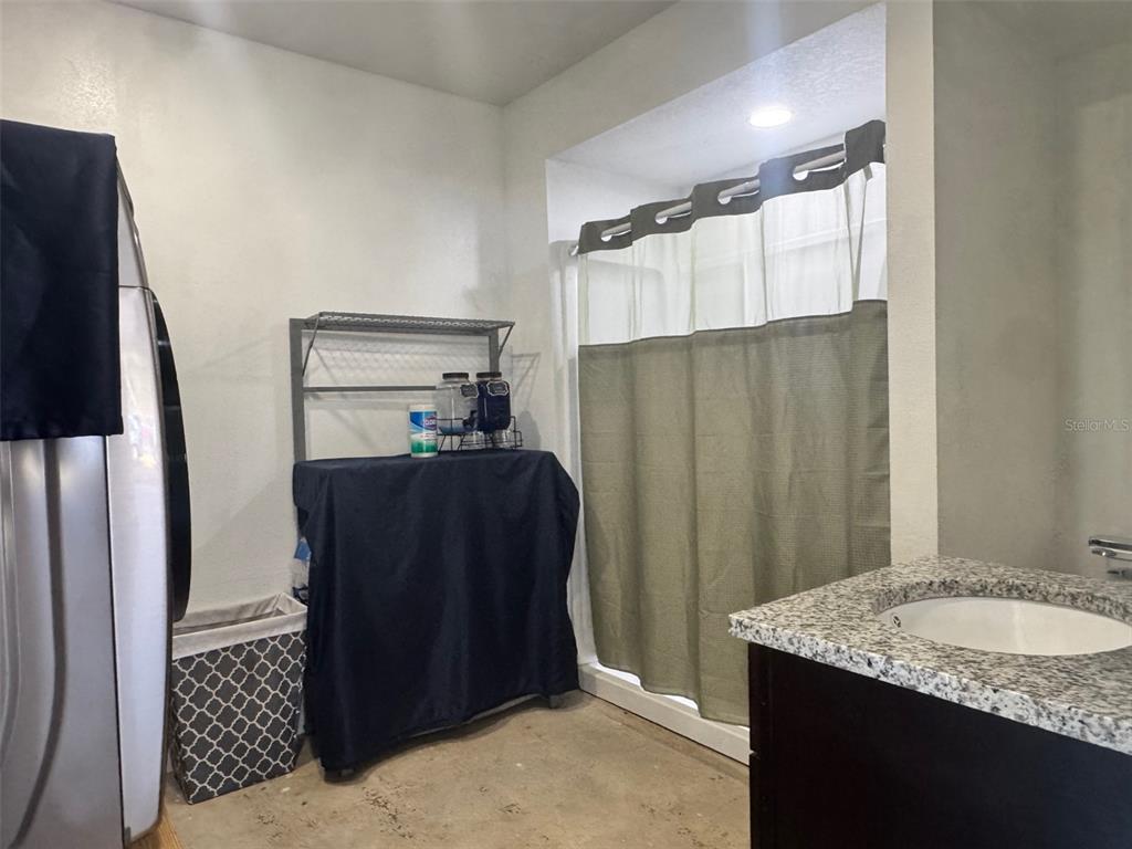 38706 River Road Dade City, FL 33525 - Photo 27 of 30 a bathroom with a granite countertop sink and a mirror