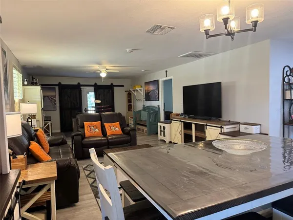 a room with furniture and a flat screen tv