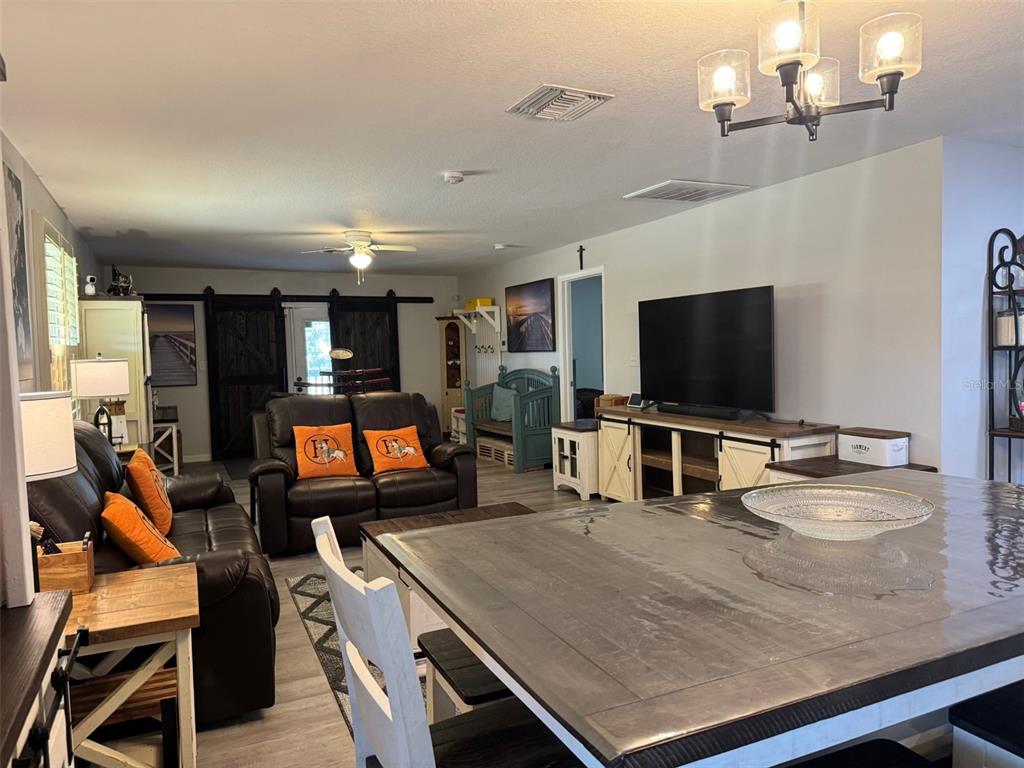 38706 River Road Dade City, FL 33525 - Photo 10 of 30 a room with furniture and a flat screen tv