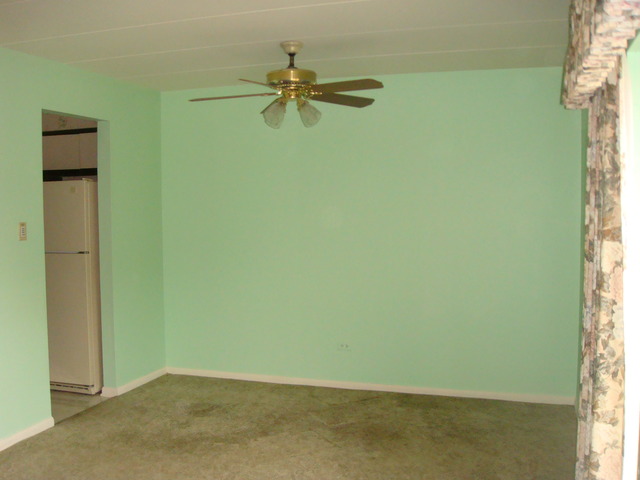 6443 Clarendon Hills Road, Unit 202 Willowbrook, IL 60527 - Photo 5 of 18 an empty room with a window and a fan