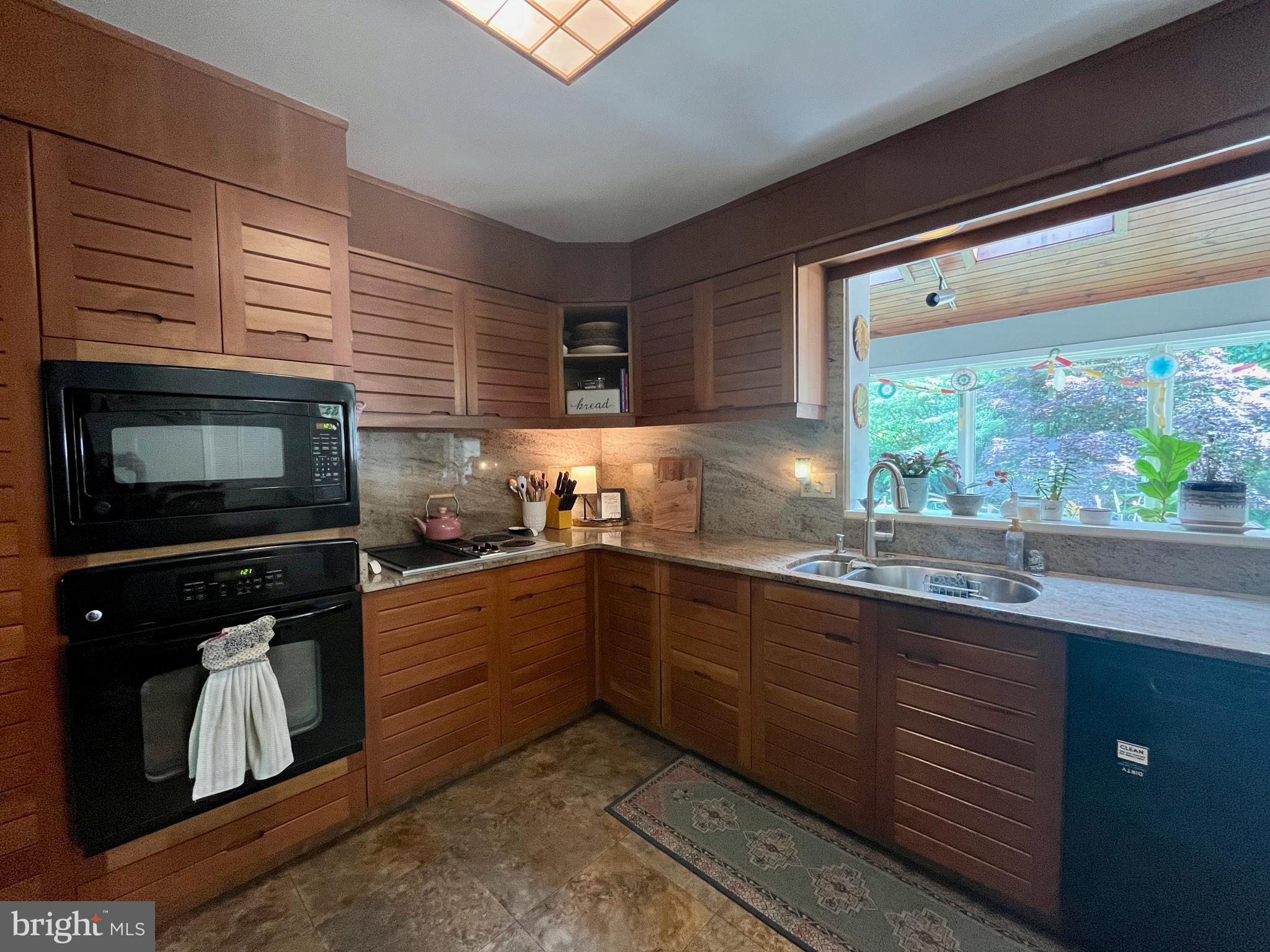 212 Haag Road Reading, PA 19606 - Photo 14 of 56 a kitchen with granite countertop cabinets stainless steel appliances and a sink