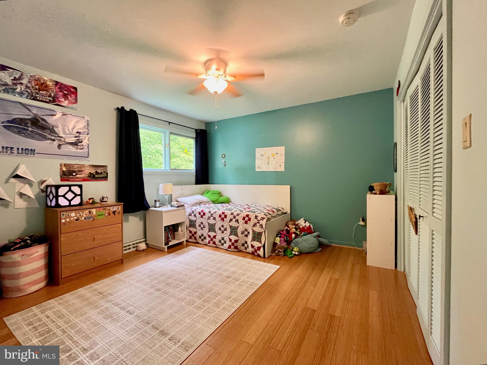 212 Haag Road Reading, PA 19606 - Photo 23 of 56 a bedroom with a large bed and a chandelier