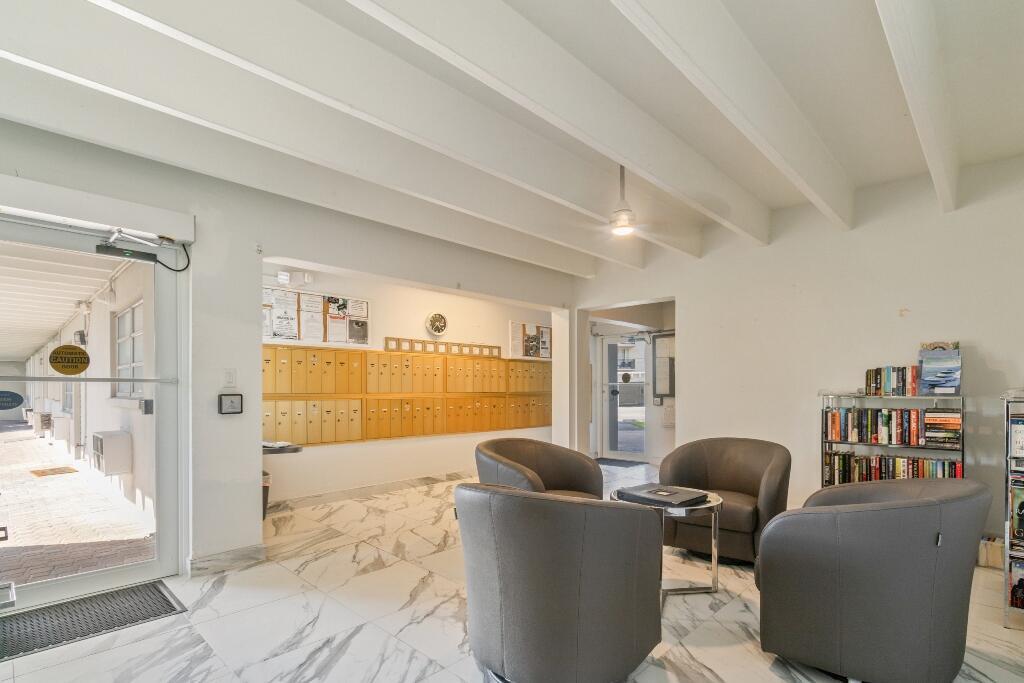 3500 South Ocean Boulevard, Unit 107 South Palm Beach, FL 33480 - Photo 14 of 24 a living room with furniture and a window