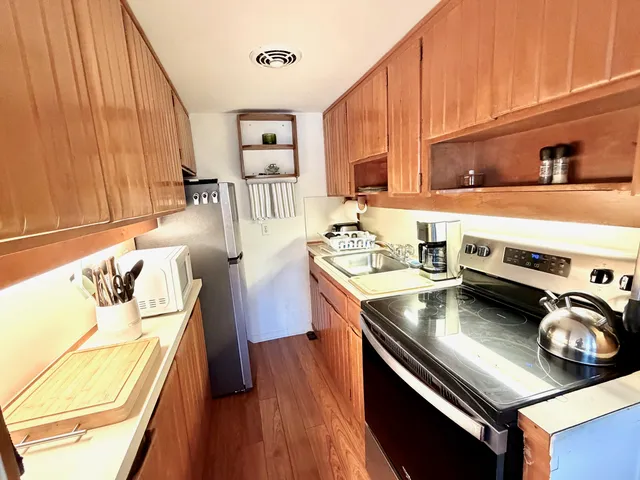a kitchen with a stove and a sink