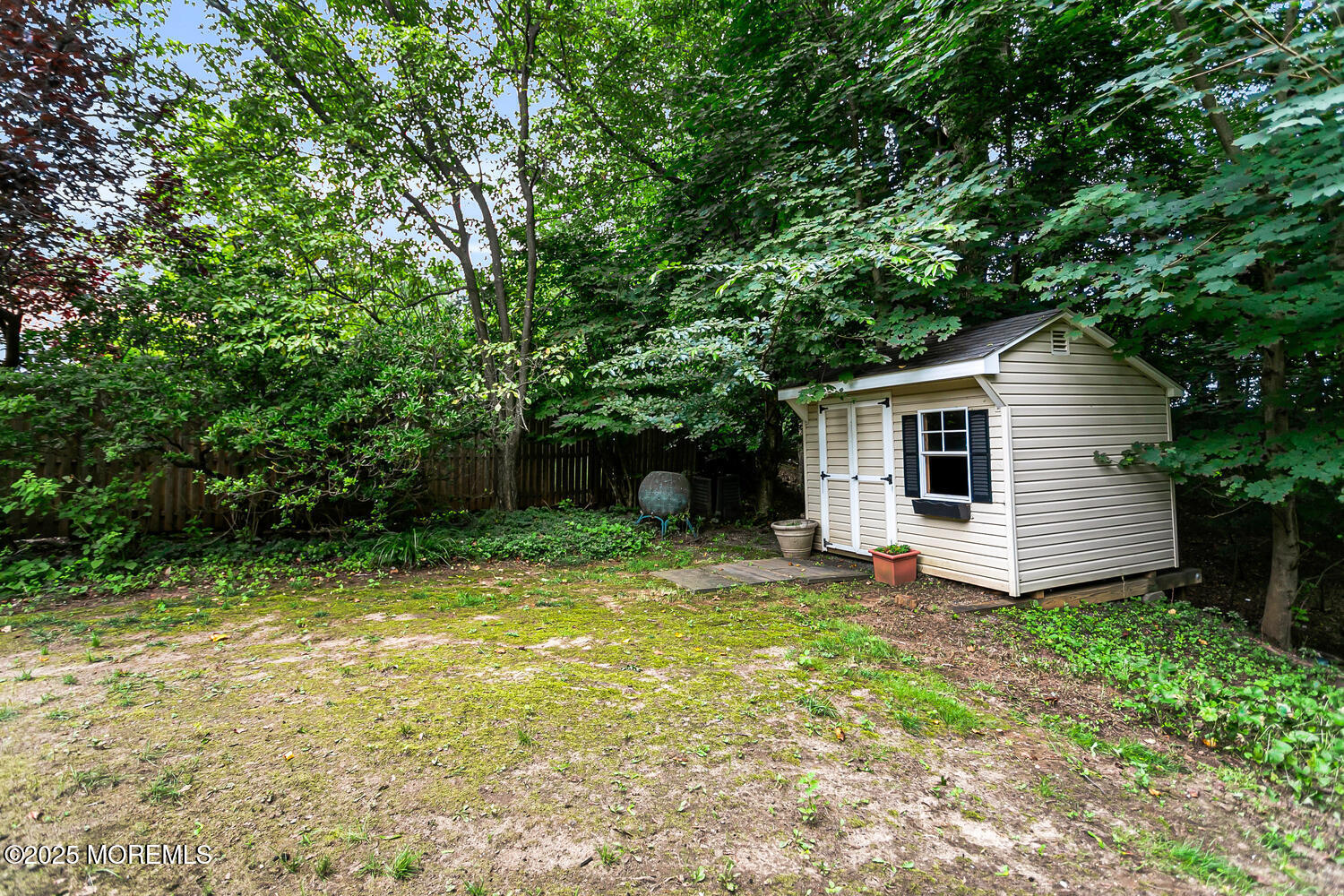 44 Tall Tree Road Middletown, NJ 07748 - Photo 11 of 62 a view of backyard with a garden and large trees