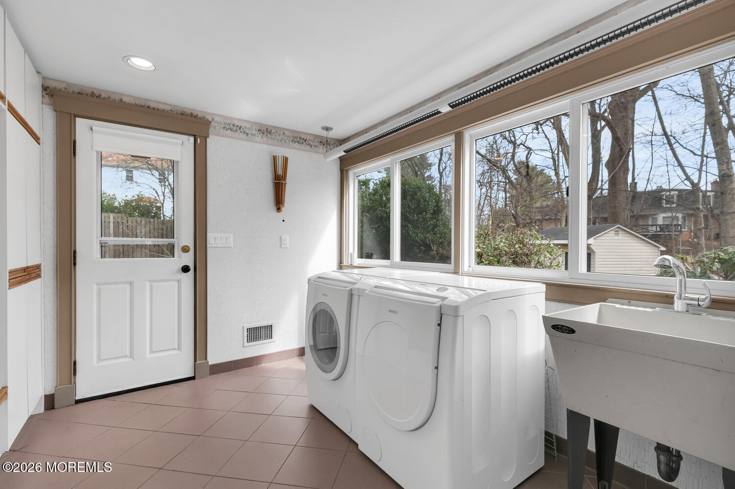 44 Tall Tree Road Middletown, NJ 07748 - Photo 22 of 62 a bathroom with a sink a mirror and next to a window
