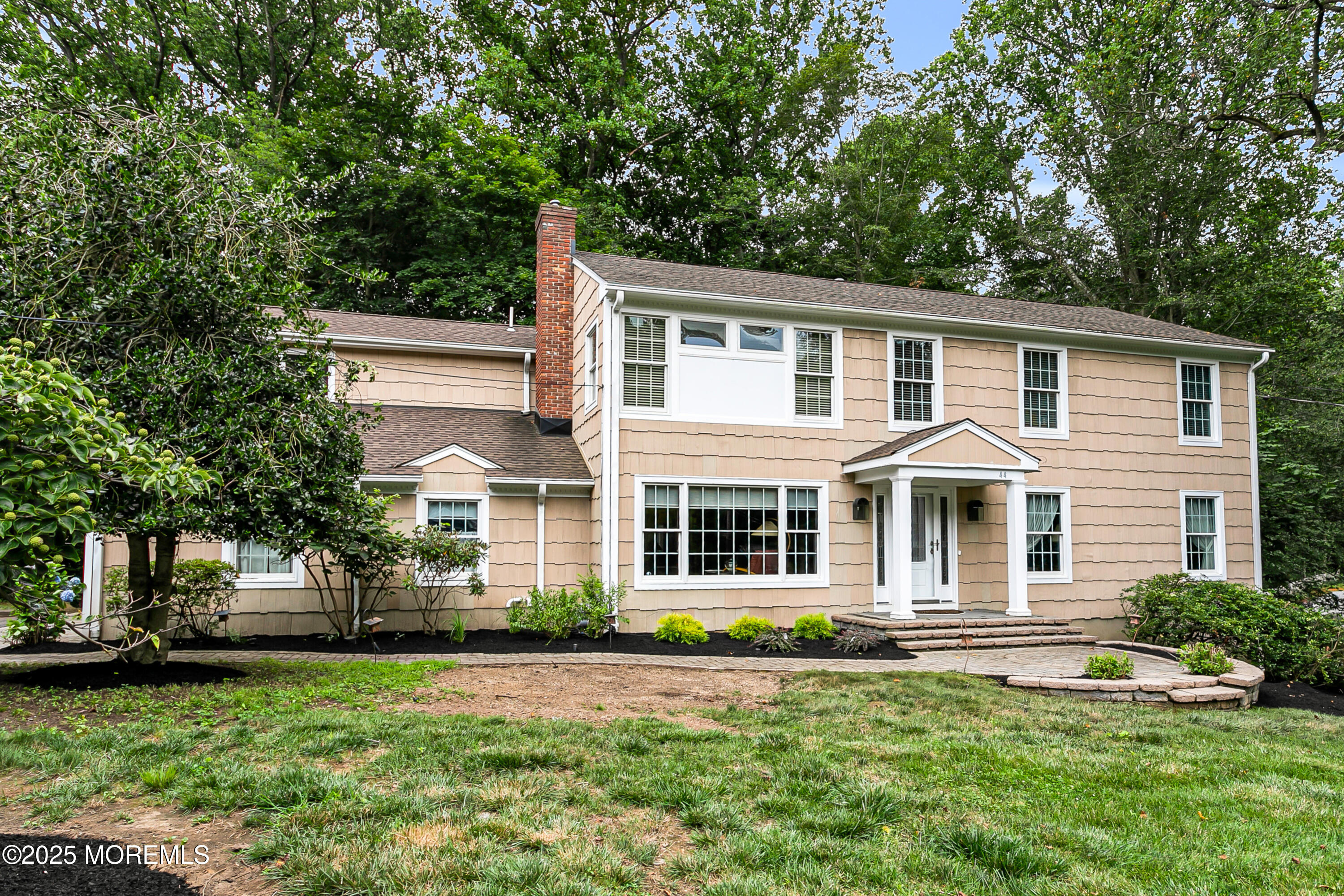 44 Tall Tree Road Middletown, NJ 07748 - Photo 34 of 62 a front view of a house with a garden