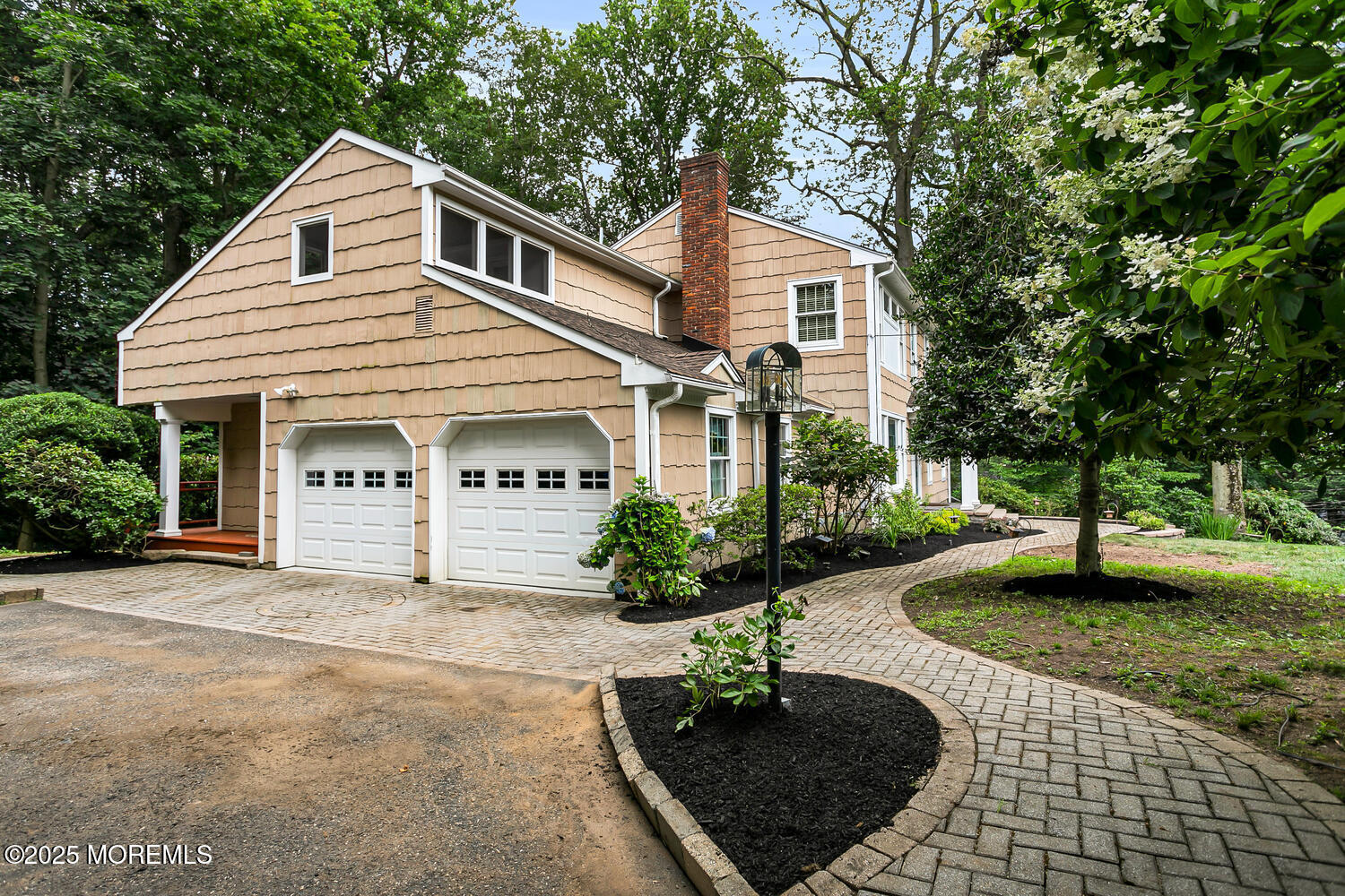 44 Tall Tree Road Middletown, NJ 07748 - Photo 35 of 62 a front view of a house with garden