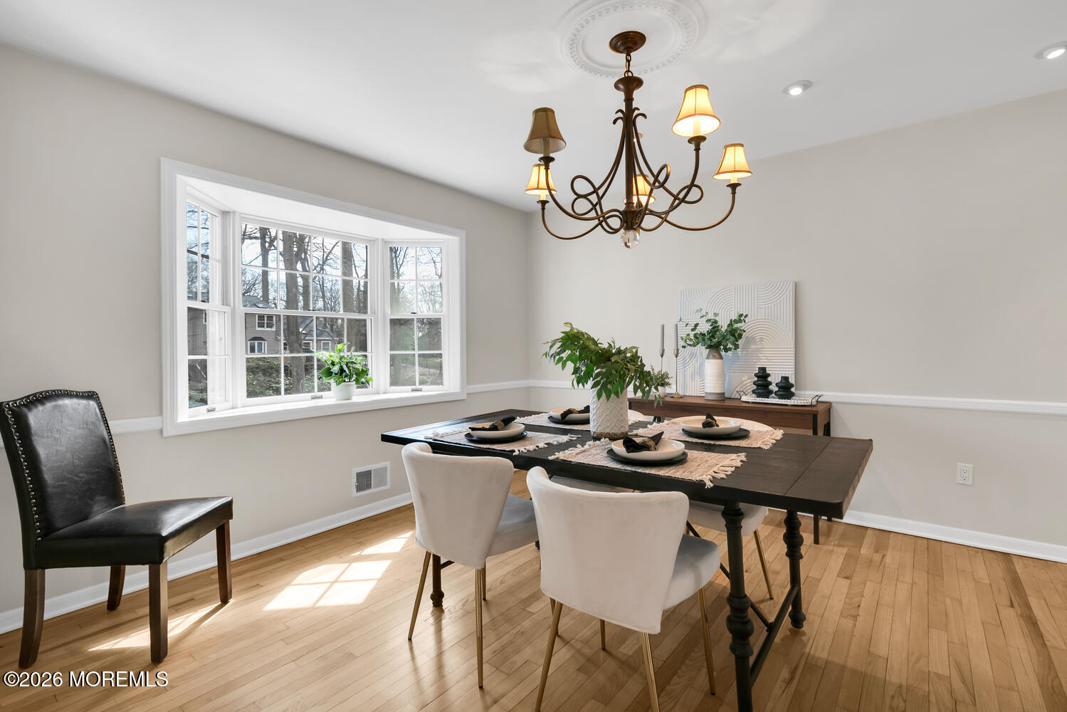 44 Tall Tree Road Middletown, NJ 07748 - Photo 50 of 62 a view of a dining room with furniture wooden floor and chandelier